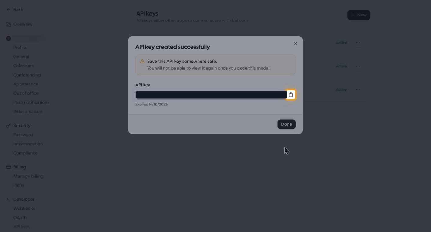 The API key created successfully dialog with the copy icon highlighted beside the redacted key value