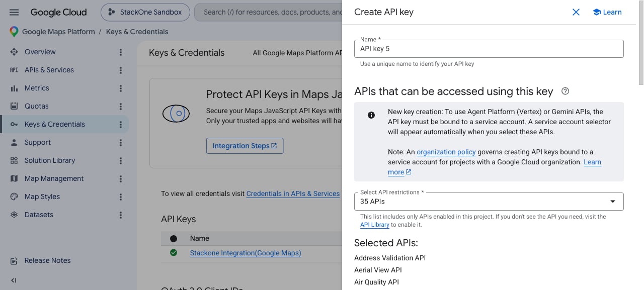 Create API key panel showing the Name field and the Select API restrictions dropdown