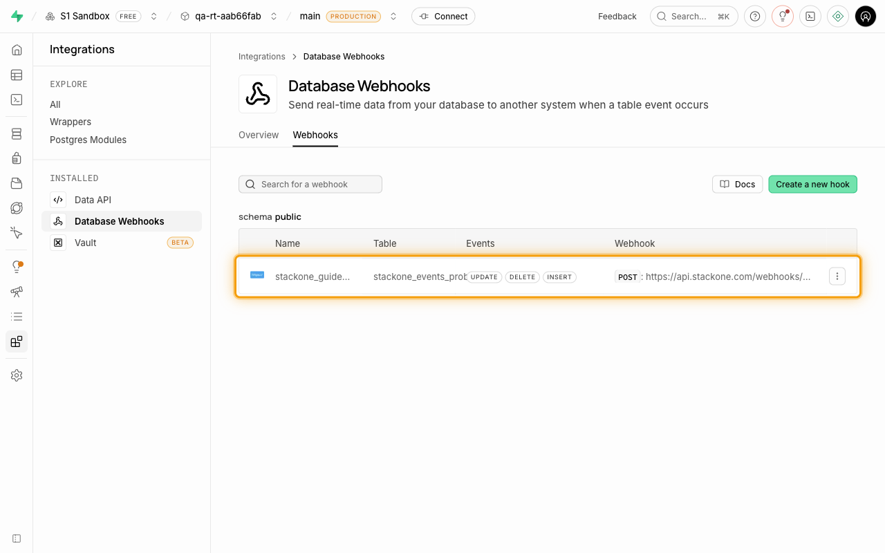 Webhooks list showing the newly created webhook row with table, events and target URL