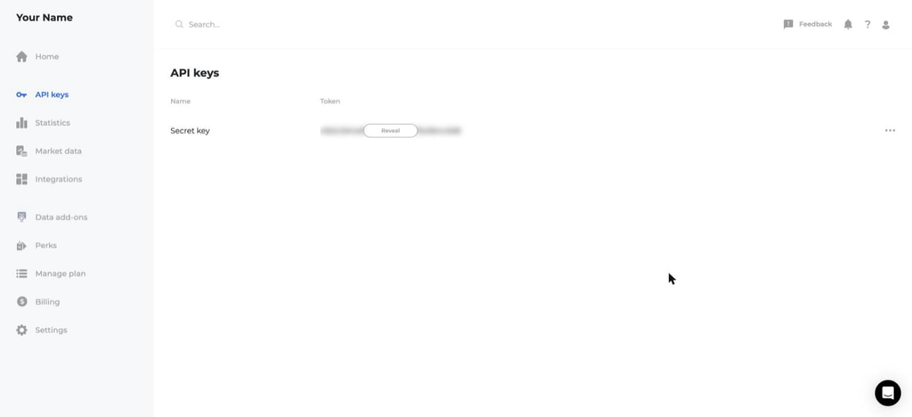The Twelve Data dashboard with the API keys page open, showing API keys selected in the left sidebar and the Secret key row with its masked token and a Reveal button