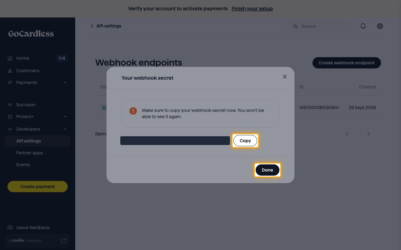 The Your webhook secret dialog with the secret value hidden and the Copy and Done buttons highlighted