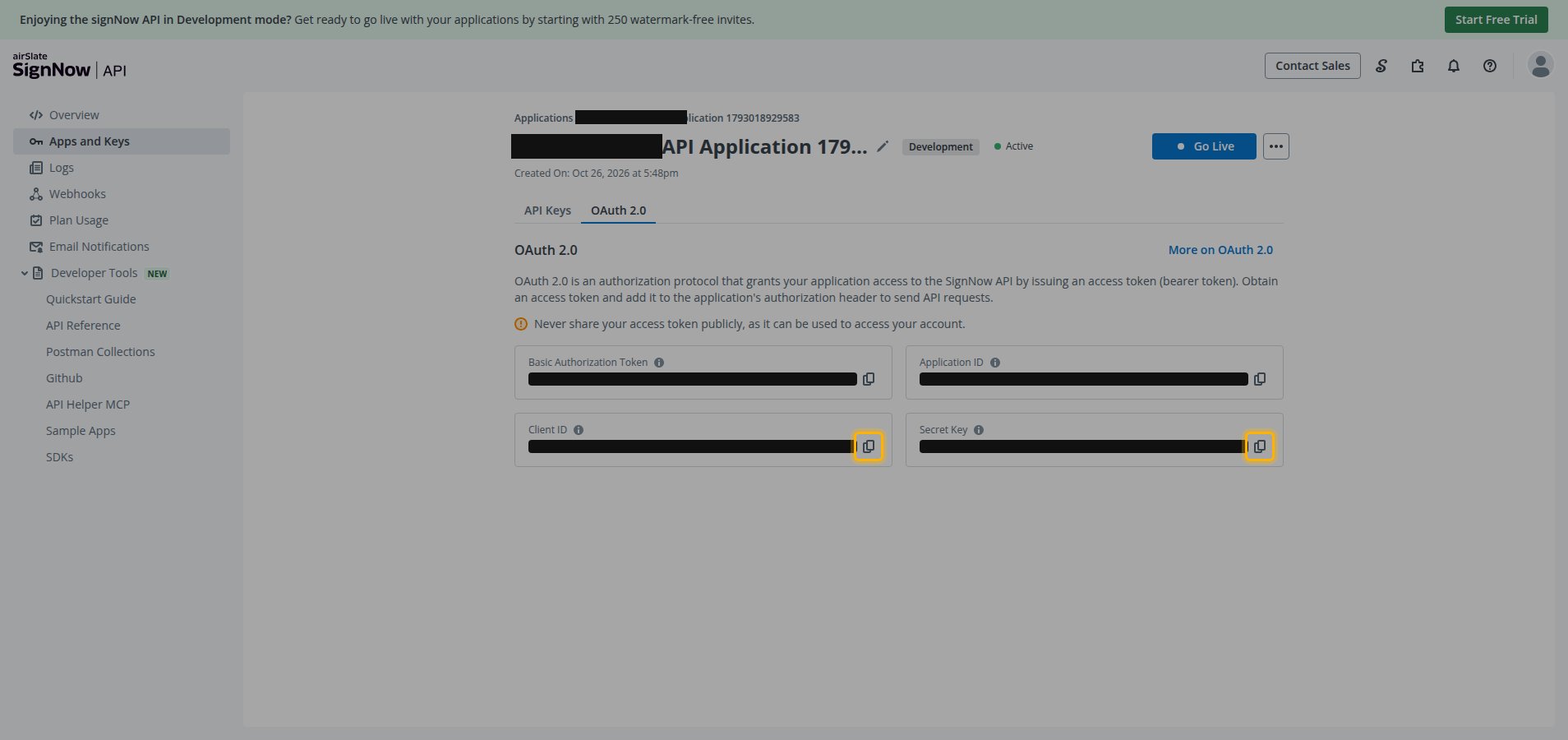 The OAuth 2.0 tab of an application showing the masked Client ID and Secret Key fields with their copy buttons highlighted