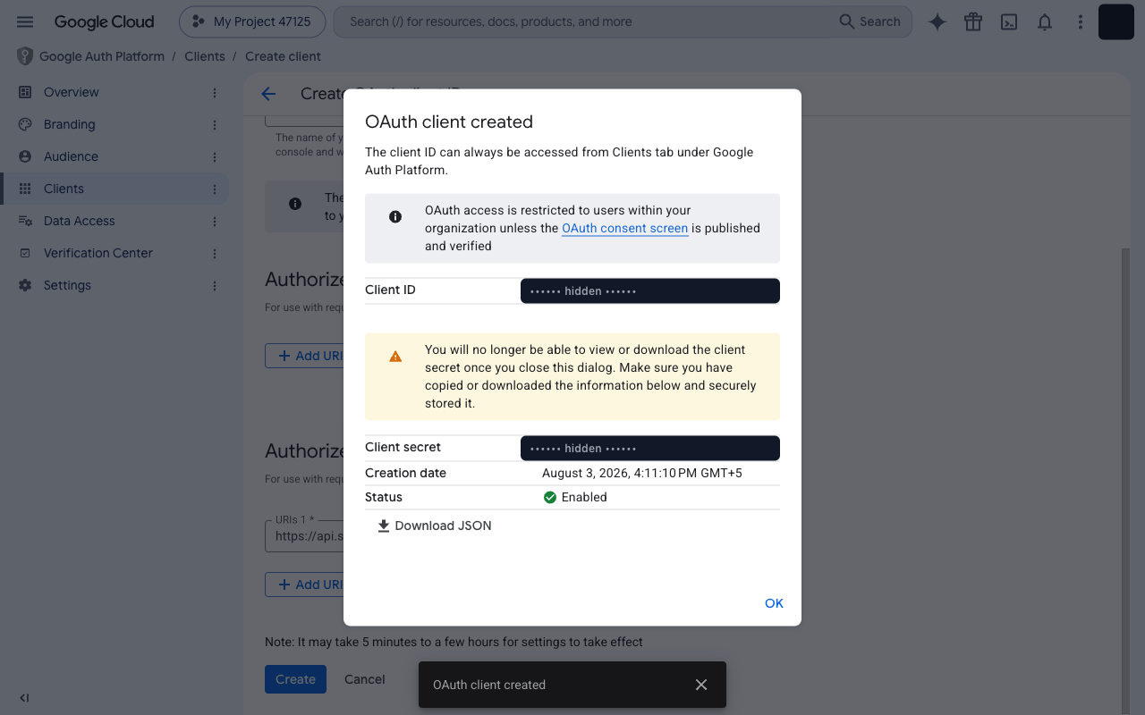 OAuth client created dialog showing the Client ID and Client secret fields (values redacted)