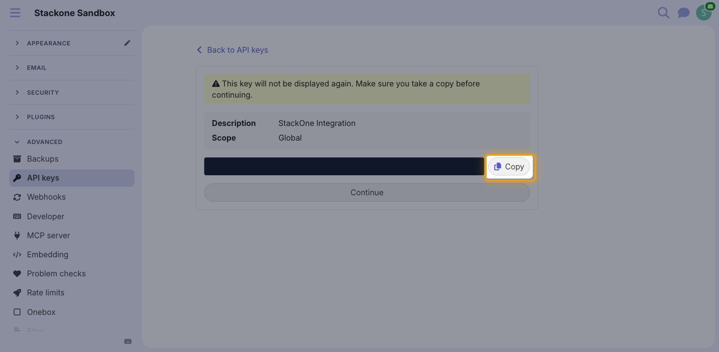 The generated API key screen with the key value hidden and the Copy button highlighted