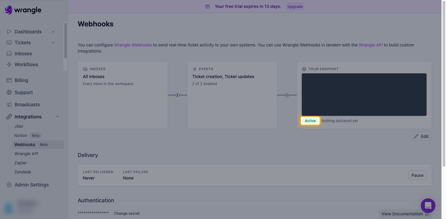 The Wrangle Webhooks page showing the endpoint with the Active status highlighted and the URL value hidden