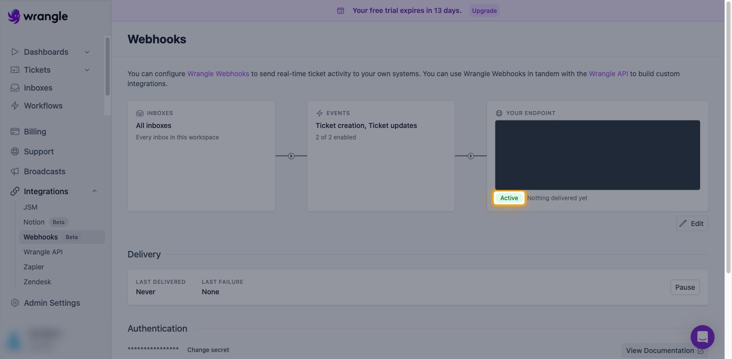 The Wrangle Webhooks page showing the endpoint with the Active status highlighted and the URL value hidden