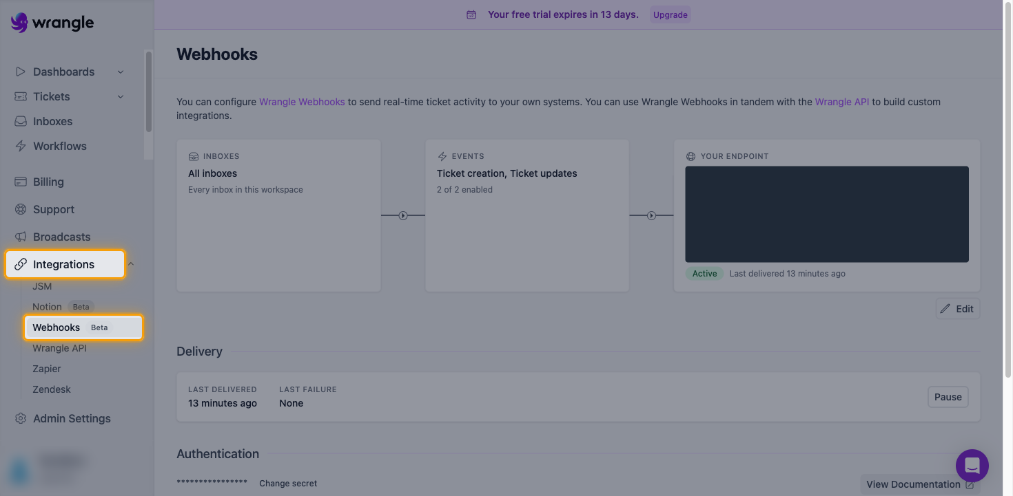 The Wrangle Webhooks page with Integrations and Webhooks highlighted in the sidebar