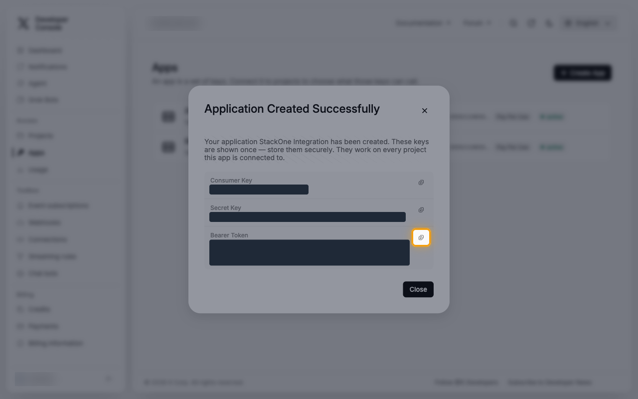 The Application Created Successfully dialog with the copy button next to Bearer Token highlighted