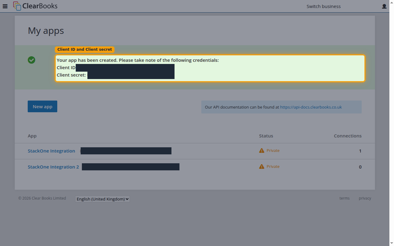 The developer portal banner shown after saving, with the Client ID and Client secret masked