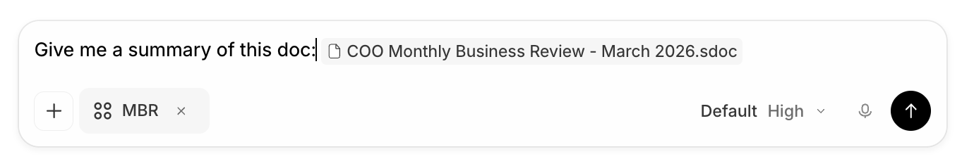 A composer reading 'Give me a summary of this doc:' with an inline file mention chip for 'COO Monthly Business Review - March 2026.sdoc', a project tag chip 'MBR' below it, and a send button on the right.
