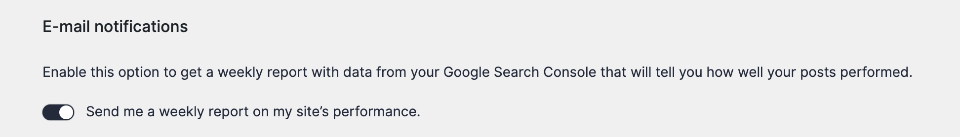 The E-mail notifications section of the plugin settings with the weekly report toggle turned on.