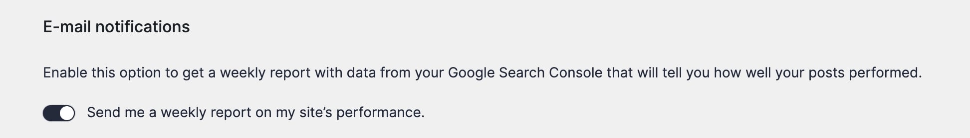 The E-mail notifications section of the plugin settings with the weekly report toggle turned on.