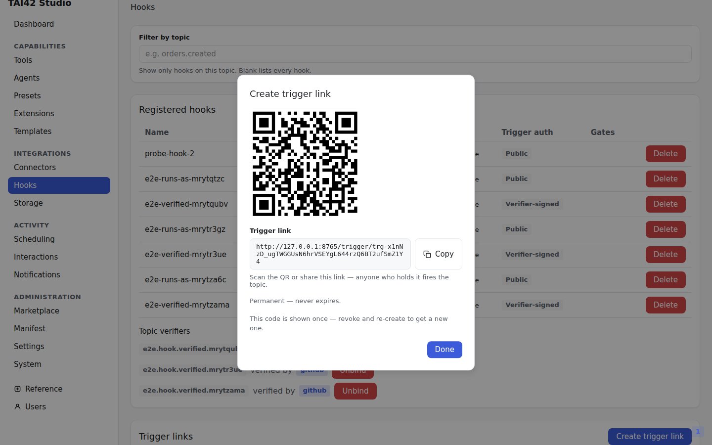 The Studio Hooks page create-trigger-link dialog showing the generated QR code.