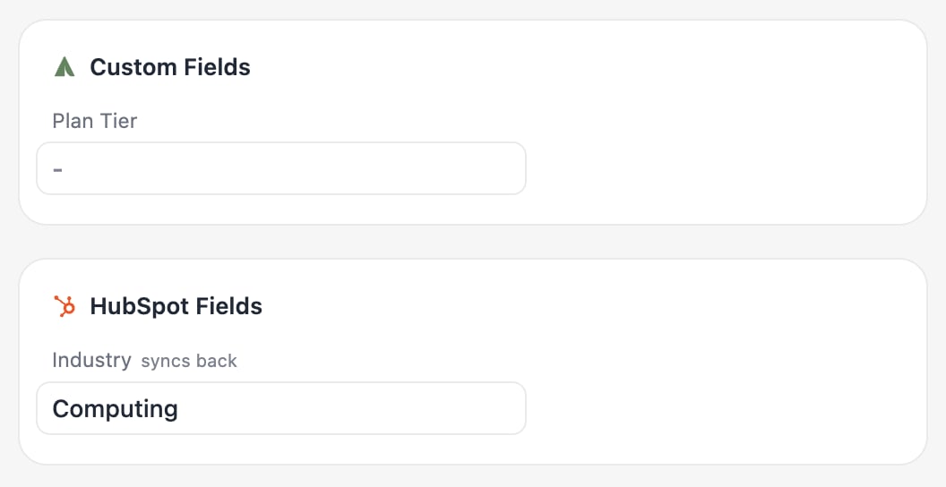 A contact in People with its HubSpot fields group; Industry is marked as syncing back.