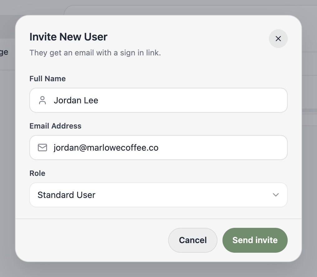 A screenshot of the Invite New User dialog with full name, email address, and role fields.