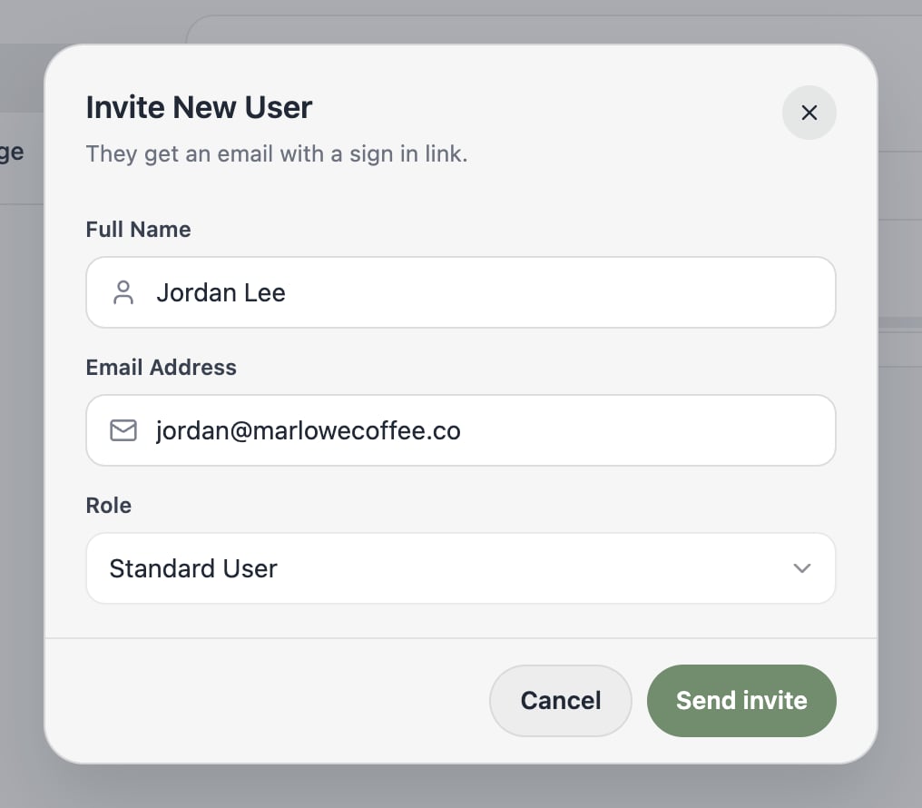 A screenshot of the Invite New User dialog with full name, email address, and role fields.