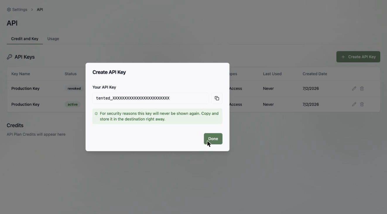 A screenshot of the Create API Key dialog showing a newly generated key and a warning that it won't be shown again.