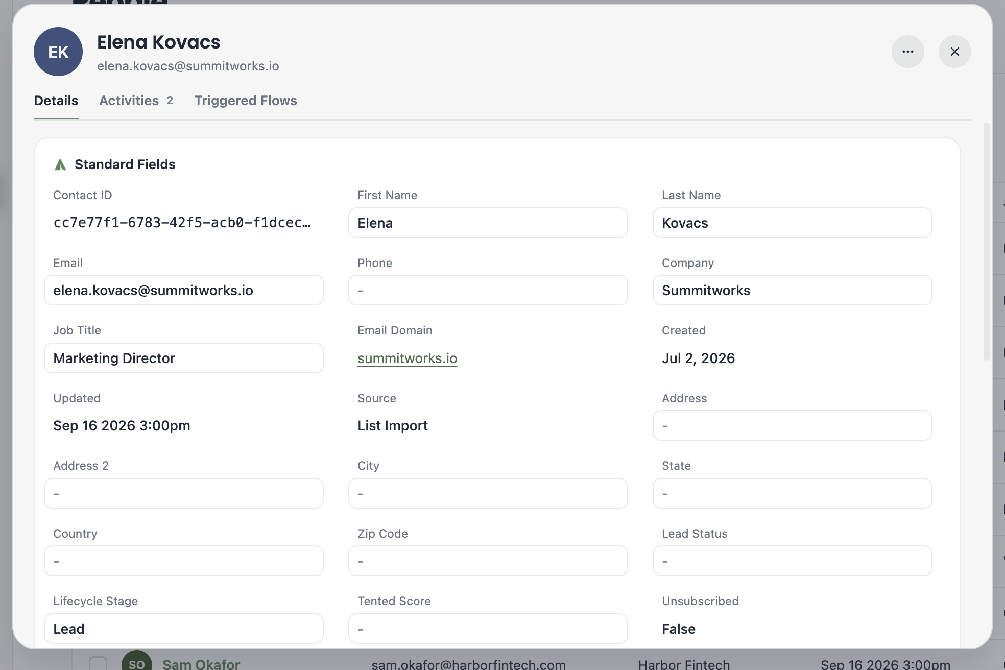 A screenshot of a contact's profile showing standard fields like name, email, company, job title, and email domain.