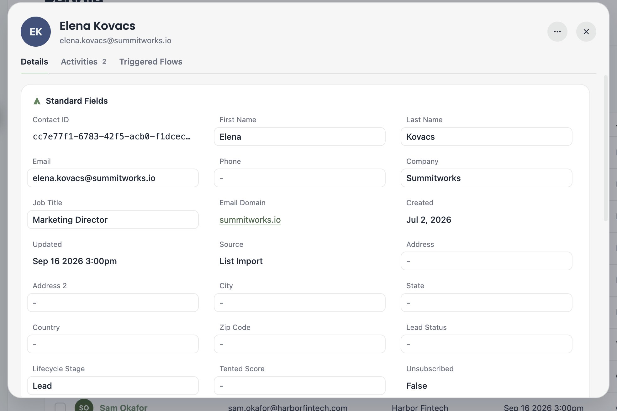 A screenshot of a contact's profile showing standard fields like name, email, company, job title, and email domain.