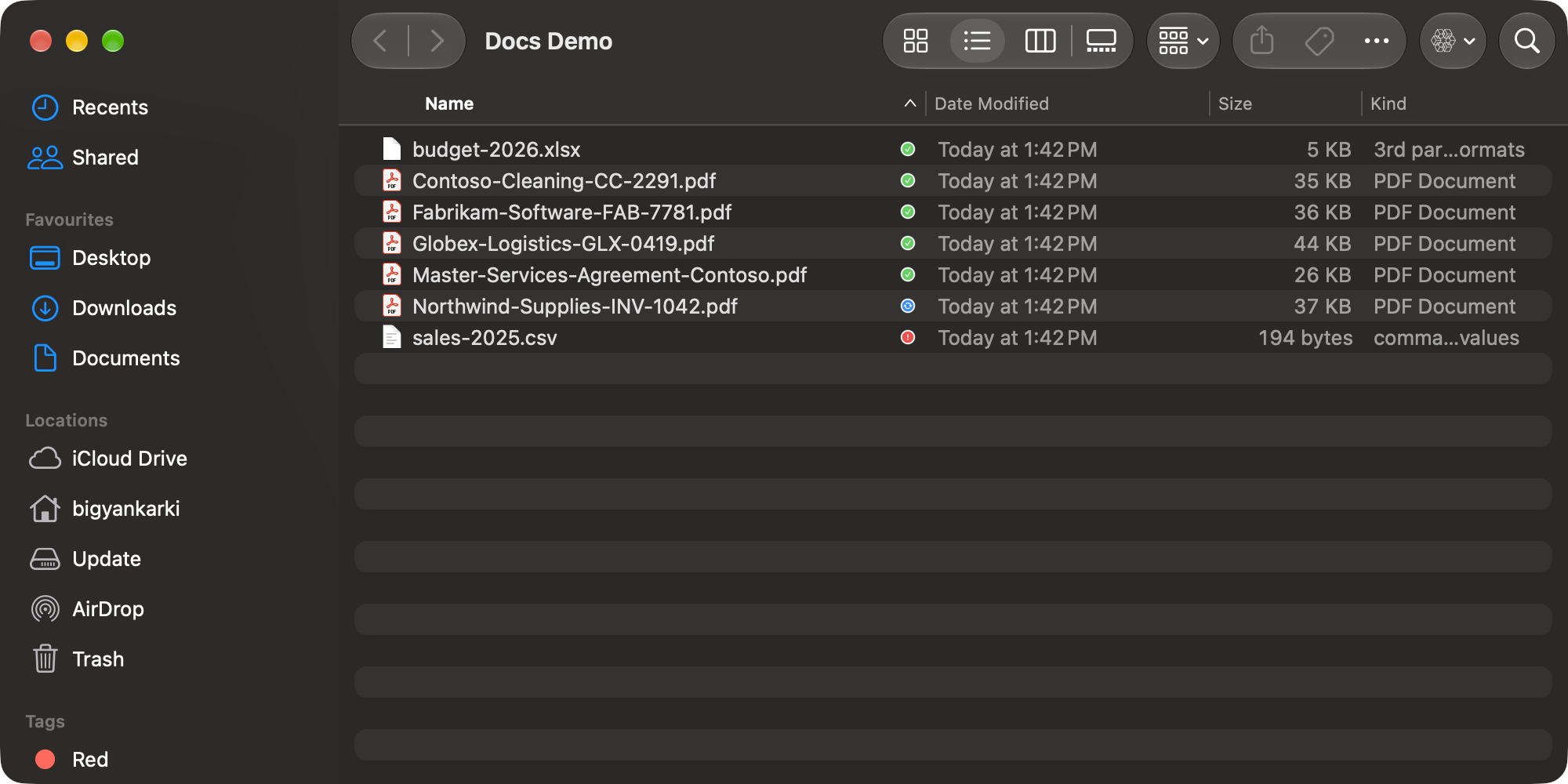 A synced folder in Finder with a green check next to most files, blue arrows next to one uploading and a red alert next to one that failed