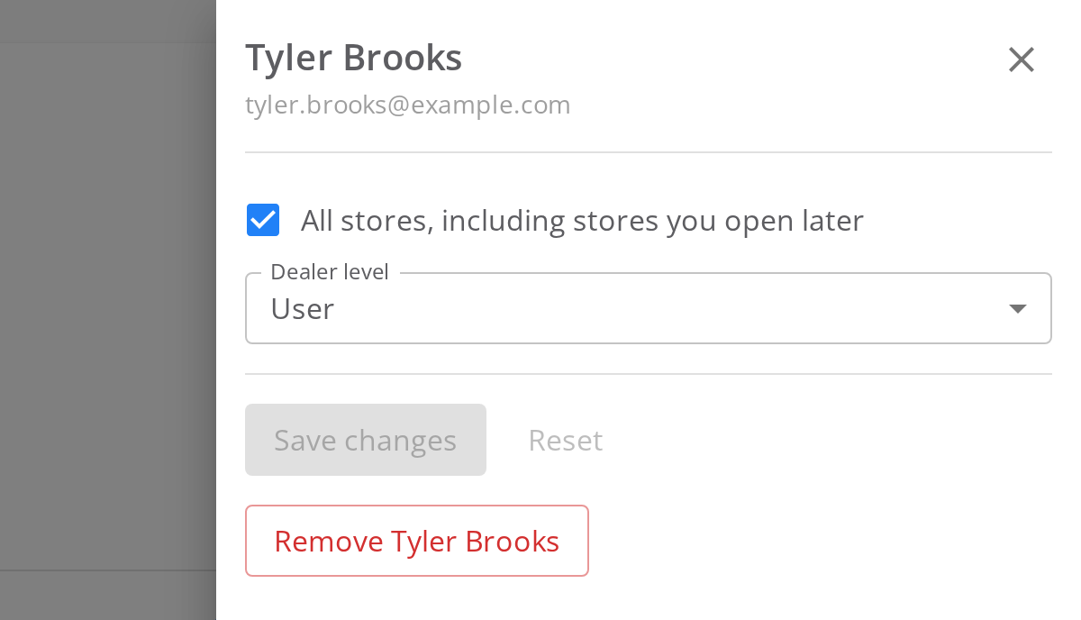 The details panel for Tyler Brooks. The All stores checkbox has a check mark, and Dealer level reads User. Below are Save changes, Reset and Remove Tyler Brooks.