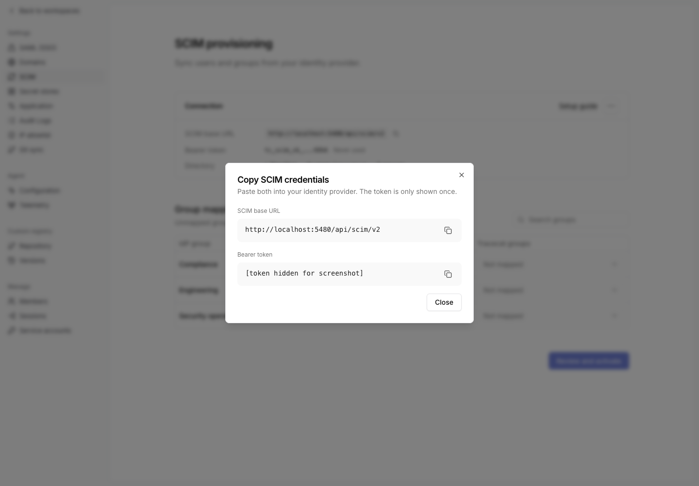 Copy SCIM credentials dialog with the bearer token hidden