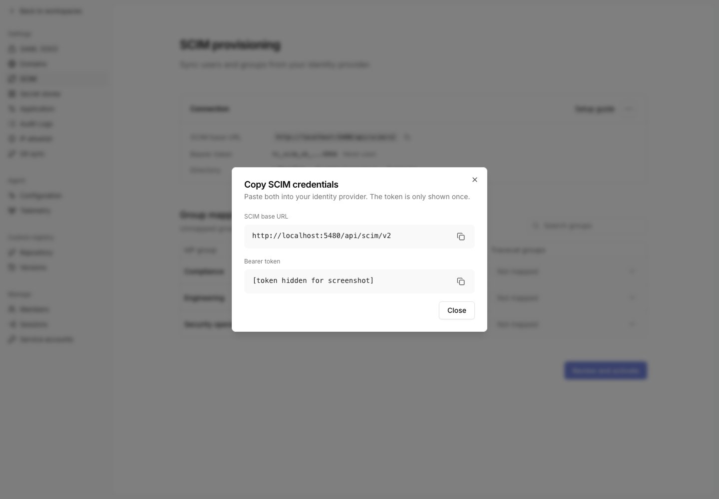 Copy SCIM credentials dialog with the bearer token hidden
