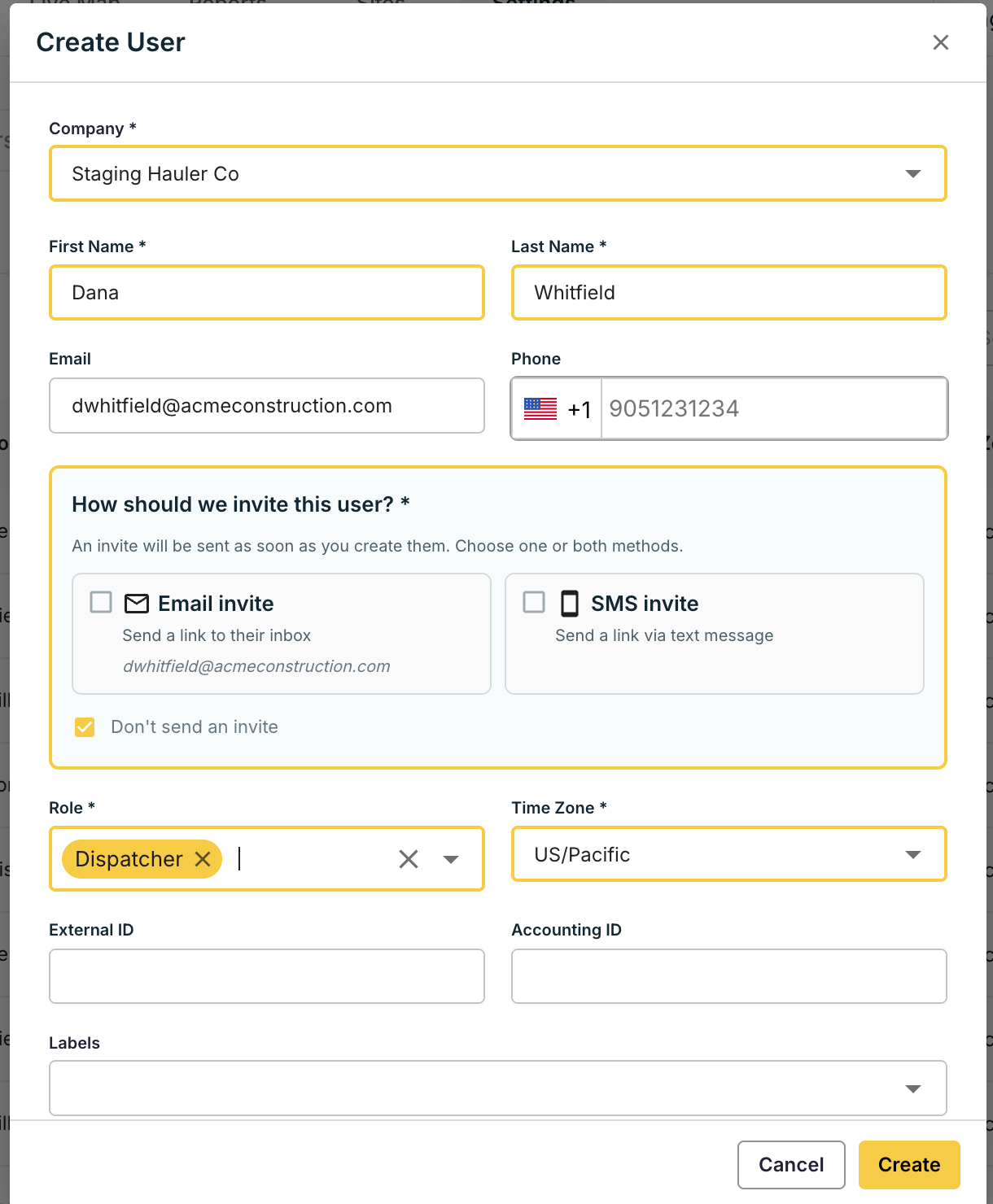 Create User form with name, email, phone, invite method, role, and time zone