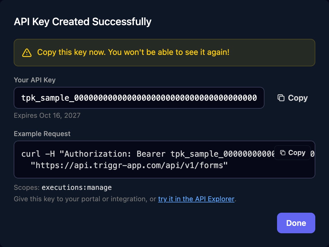 The API Key Created Successfully dialog warning Copy this key now. You won't be able to see it again!, a sample tpk_ key with a Copy button, an expiry date, an Example Request curl command for /api/v1/forms, and the scope executions:manage.