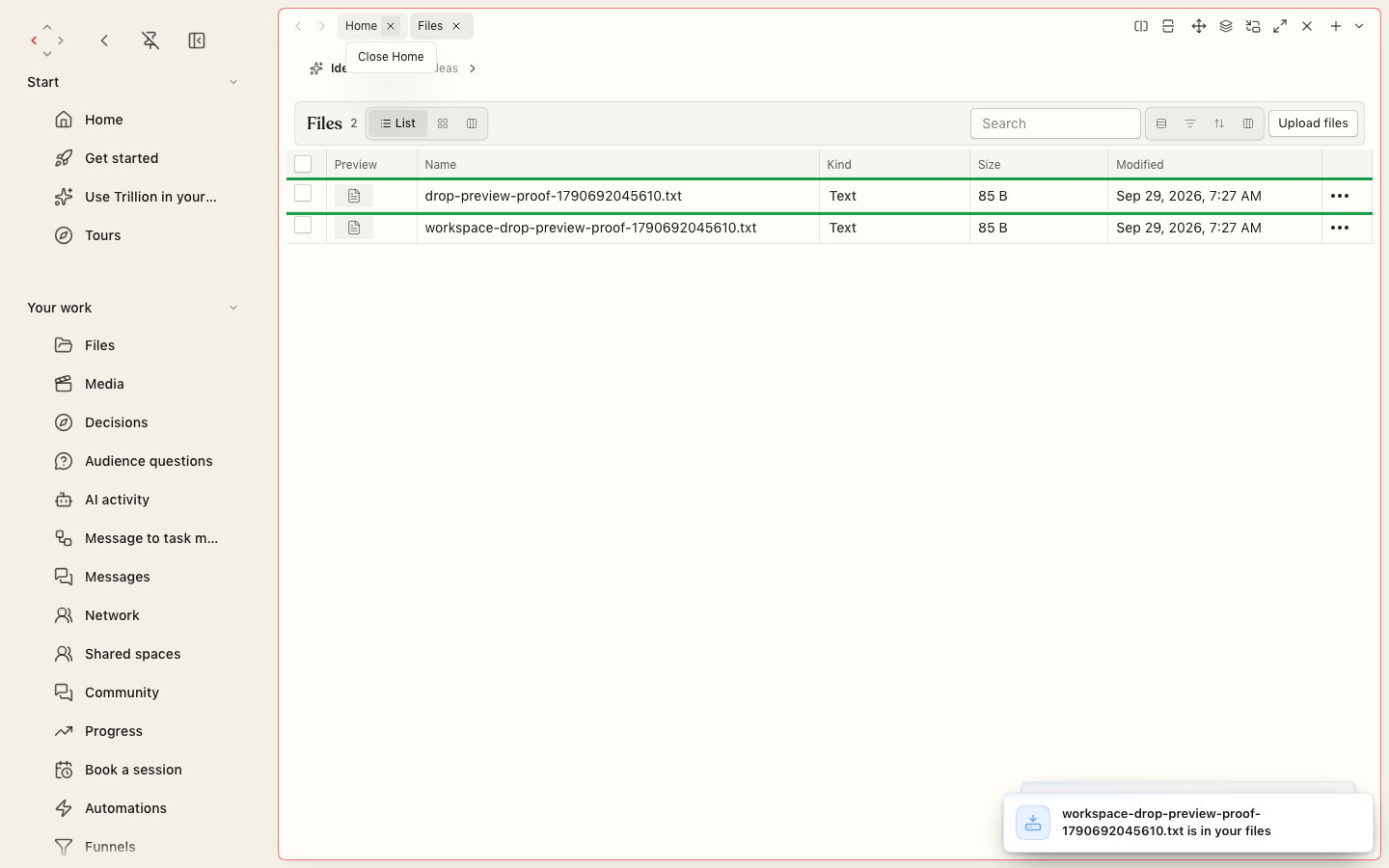 The Files screen listing two text files with their kind, size and modified date, a search box, view switches and an Upload files button, with a notice saying a file is in your files