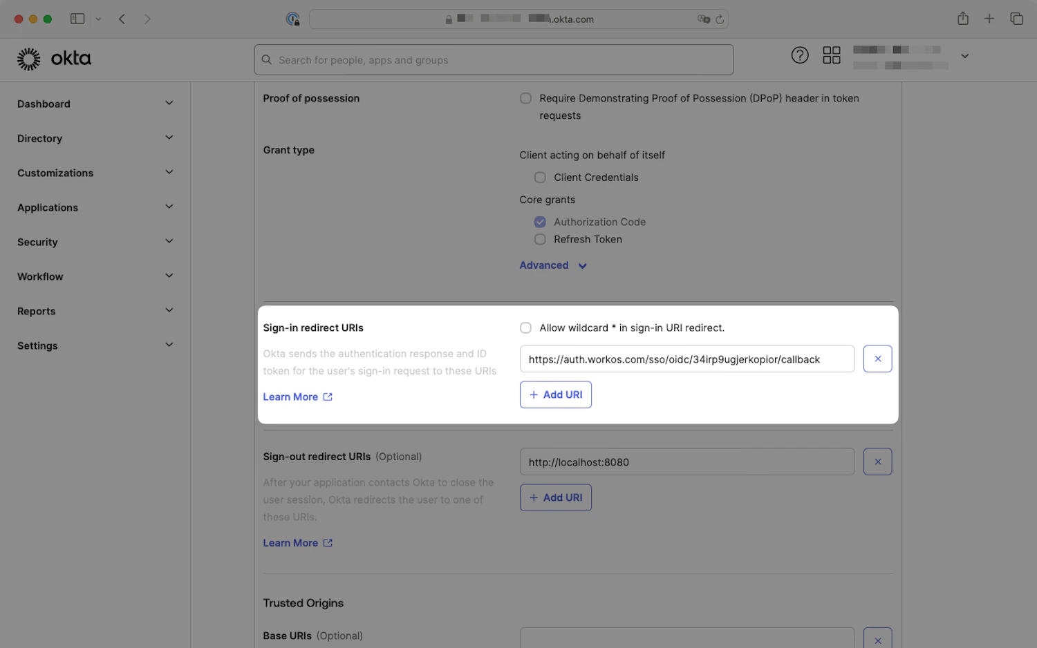 Okta New Web App Integration page with the Sign-in redirect URIs section highlighted
