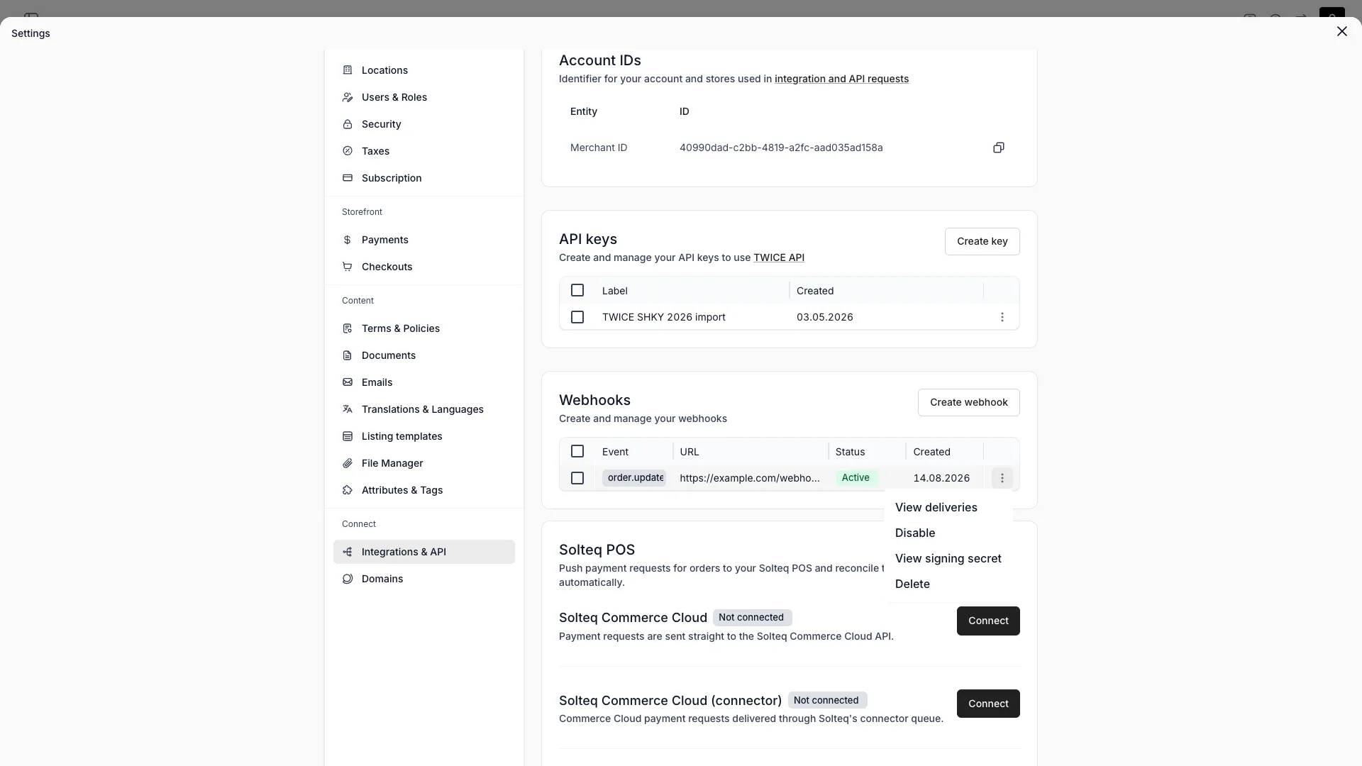 Webhooks table with event, URL, status, created date, and the row actions menu open