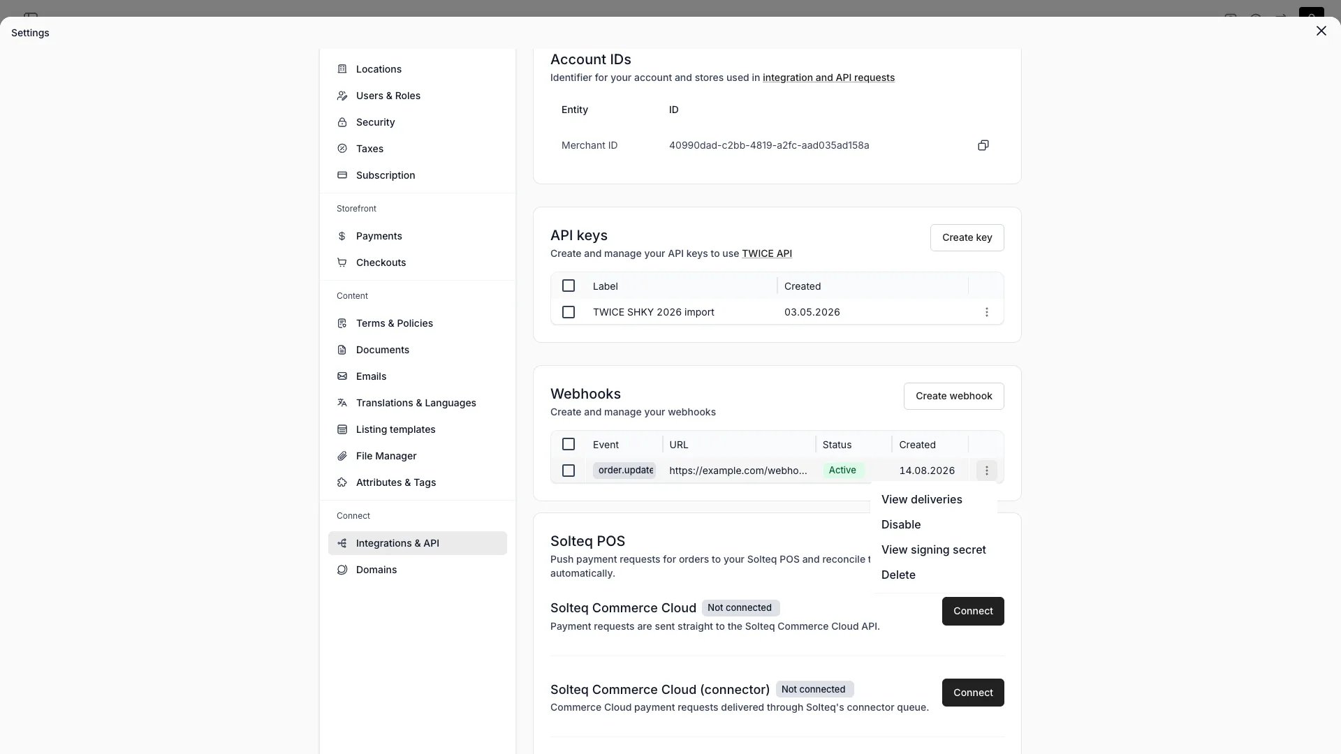 Webhooks table with event, URL, status, created date, and the row actions menu open