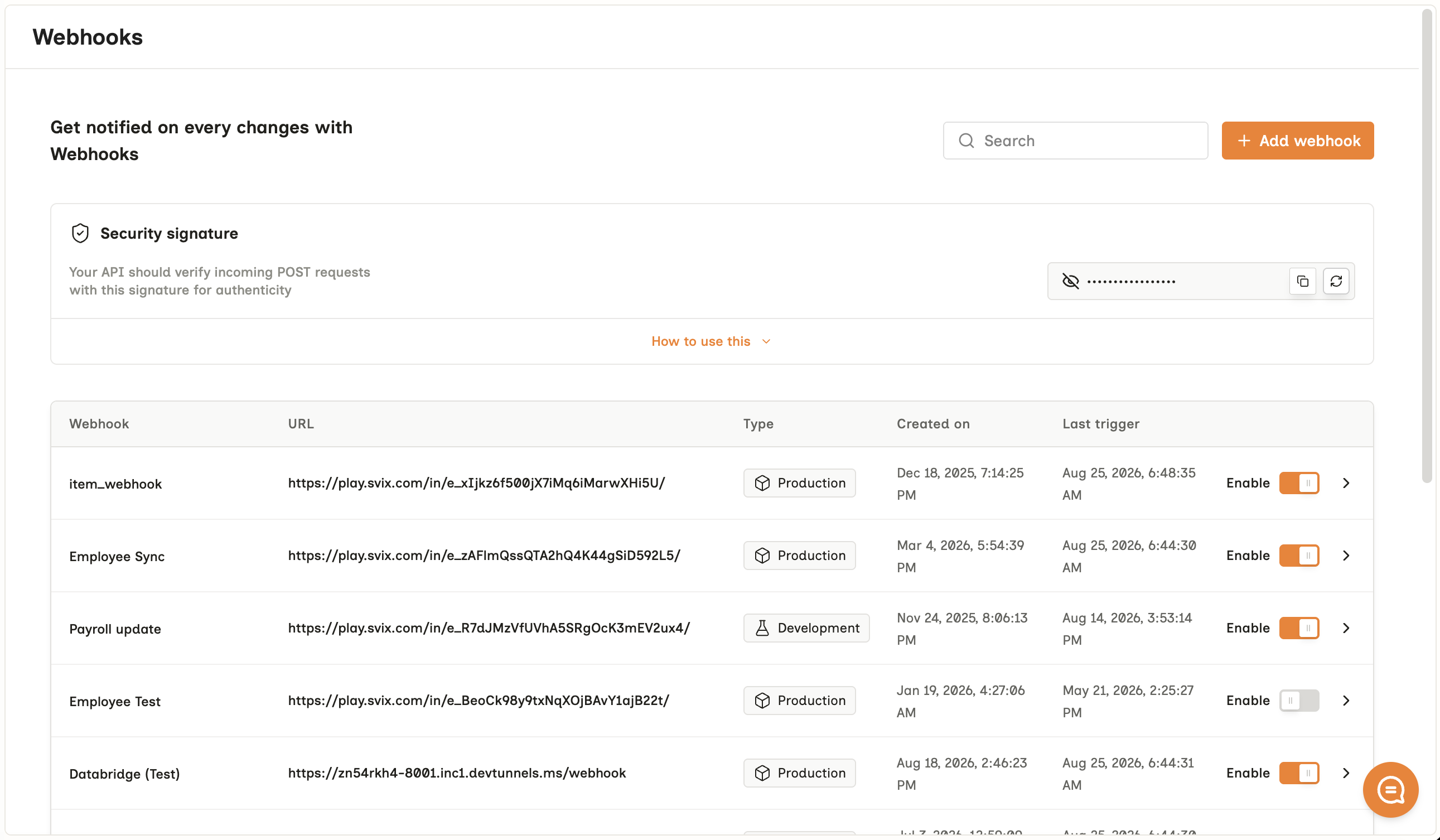 The Webhooks screen with an Add webhook button, a Security signature panel holding the masked signing key, and a table of webhooks listing each destination URL, its Production or Development type, when it was created, when it last triggered, and an Enable toggle