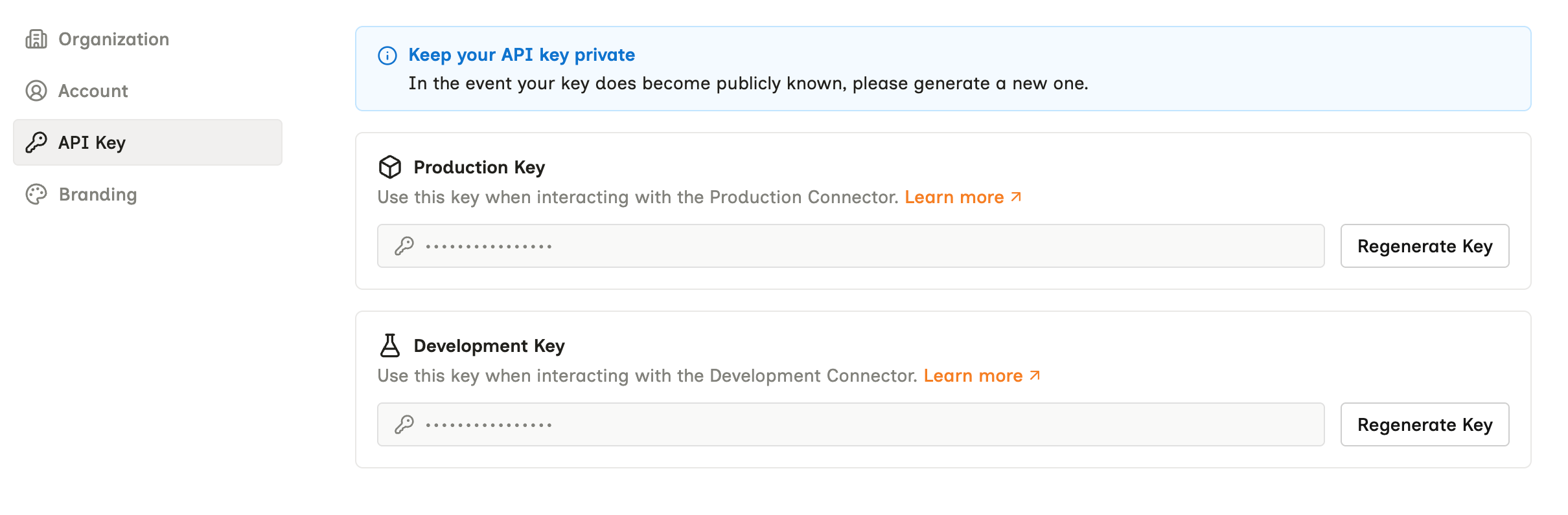 The API Key settings page, showing a Production Key block and a Development Key block, each with a masked value and a Regenerate Key button