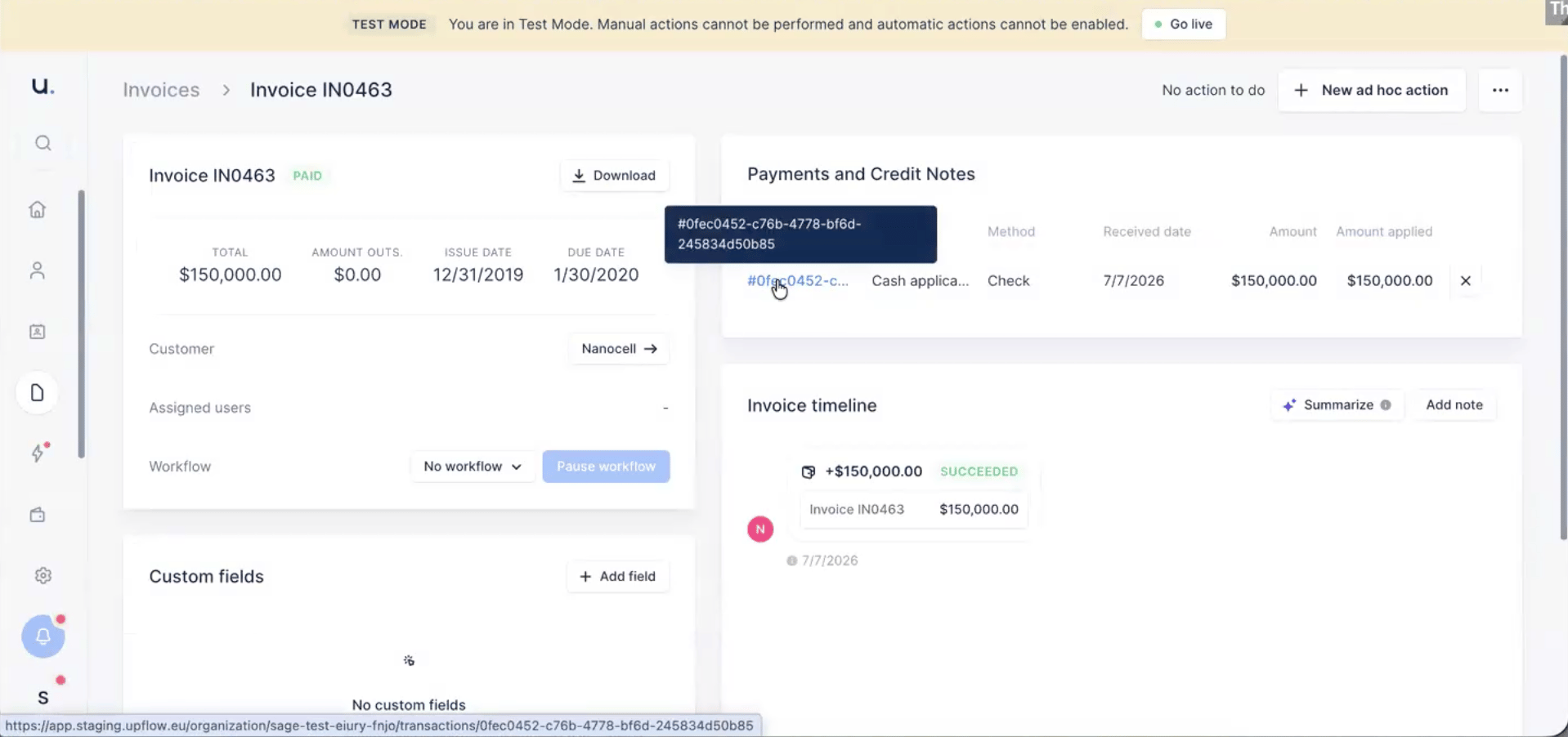 An Upflow invoice detail page showing a paid invoice with a Cash application payment applied for the full amount.