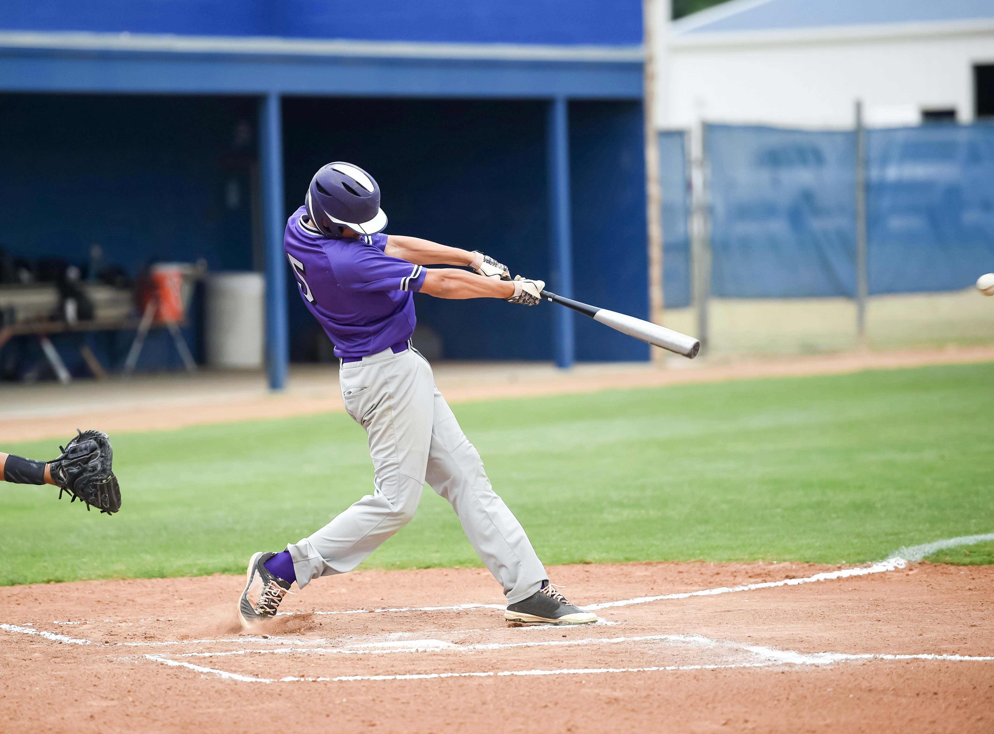 Athlete completing a swing at full arm extension