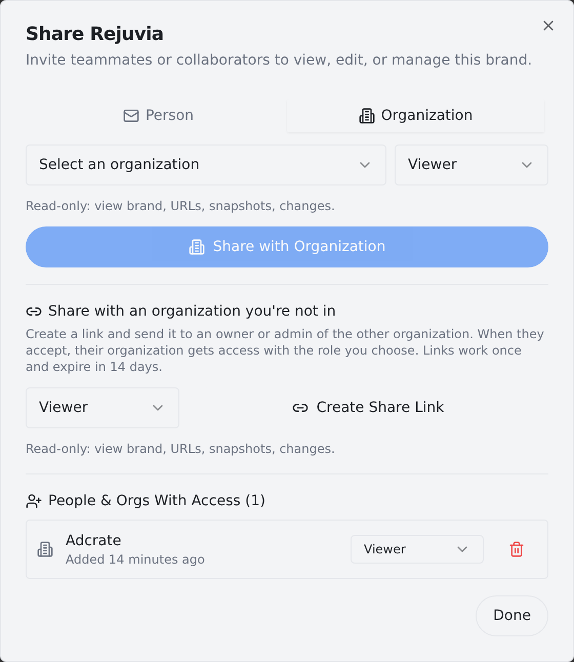 The Share modal showing the accepted organization in the People & Orgs With Access list, with a role dropdown and a revoke button.