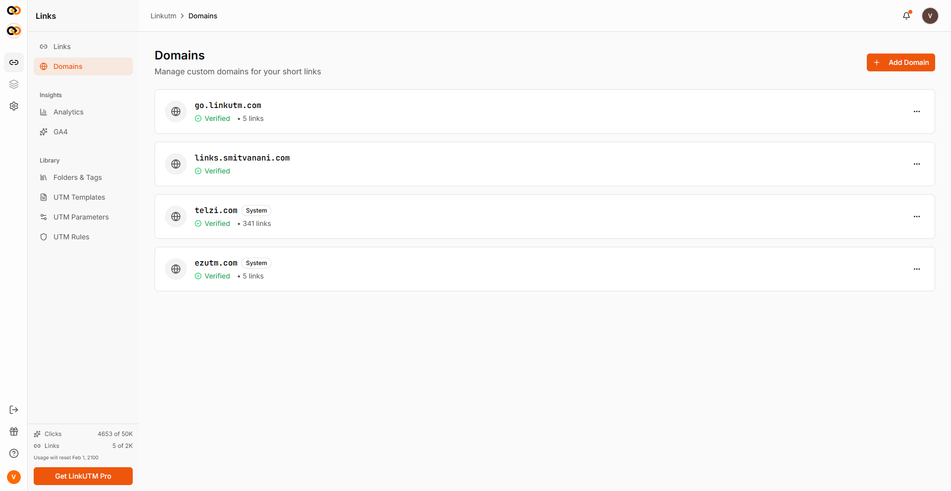 Domains page - list of custom and system domains with Verified status badges