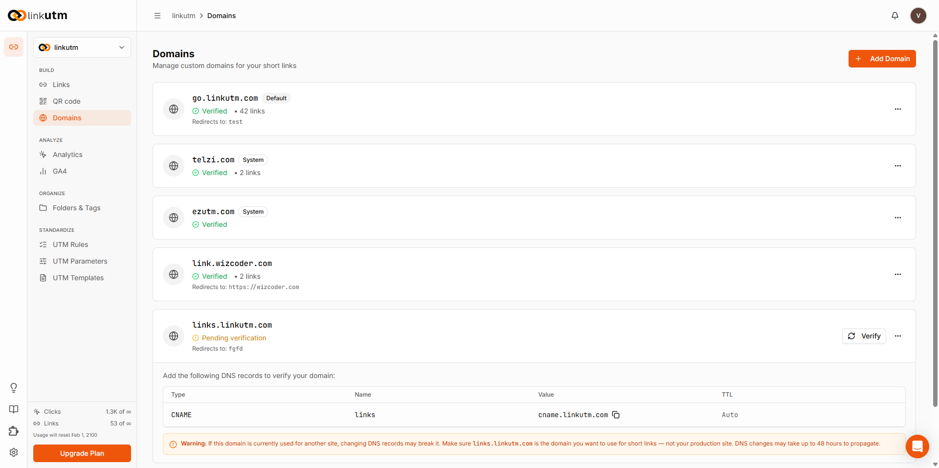 Domains page - list of custom and system domains with Verified status badges