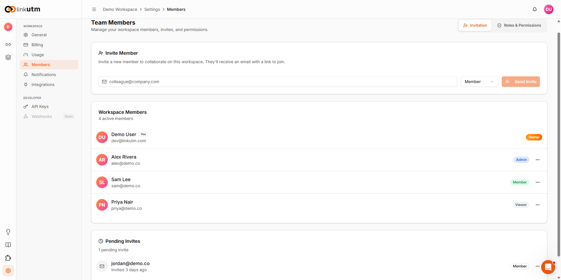 Team Members page - invite form, member list with roles (Owner/Admin/Member/Viewer), and Roles and Permissions table