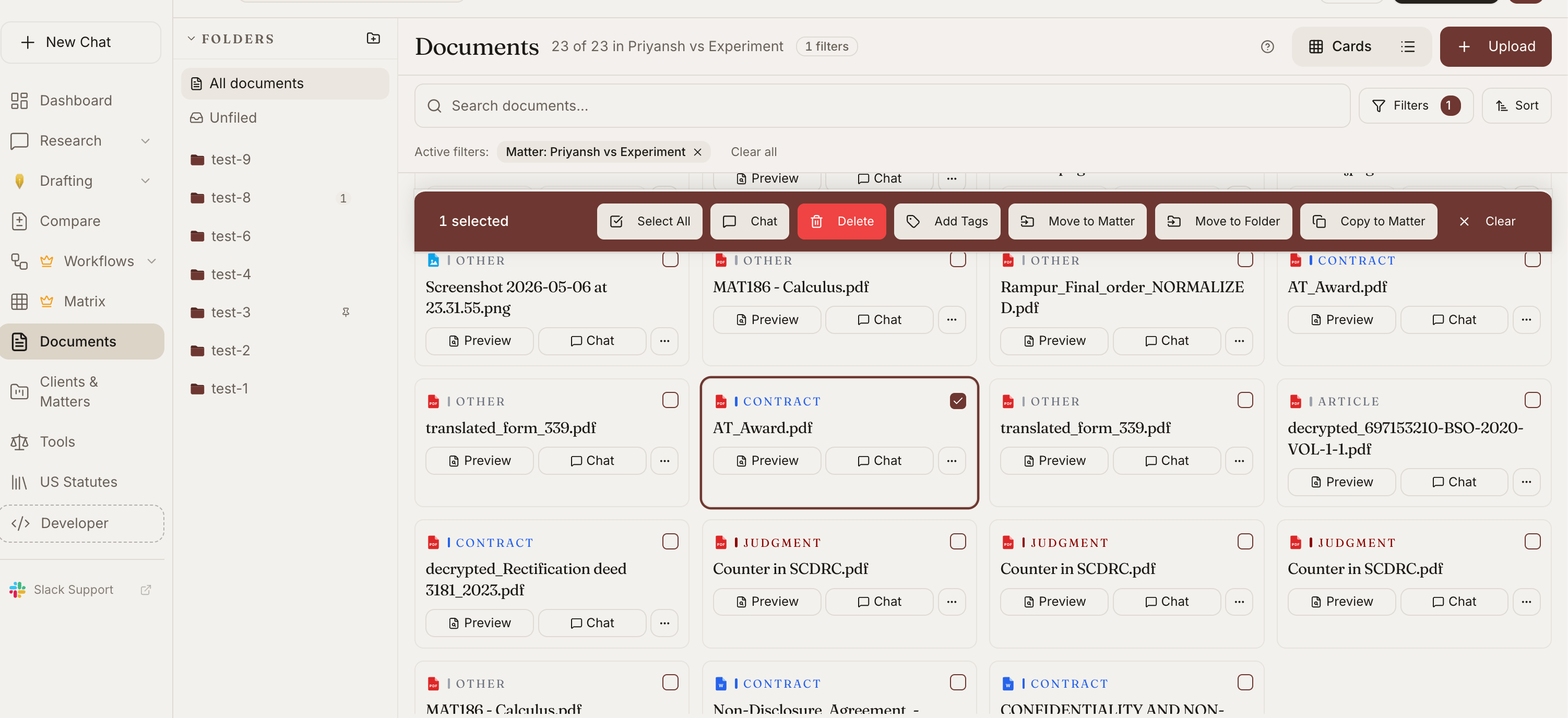 Document library showing tagged cards (CONTRACT, JUDGMENT, ARTICLE) with matter filtering, bulk actions, preview, and chat