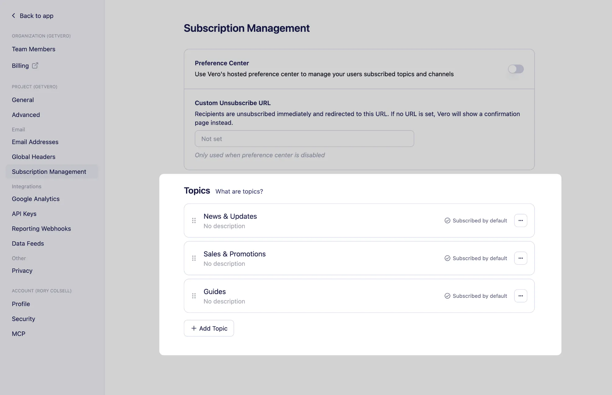 The Topics section of Subscription Management, listing three topics with drag handles, their default status, an actions menu, and the Add Topic button