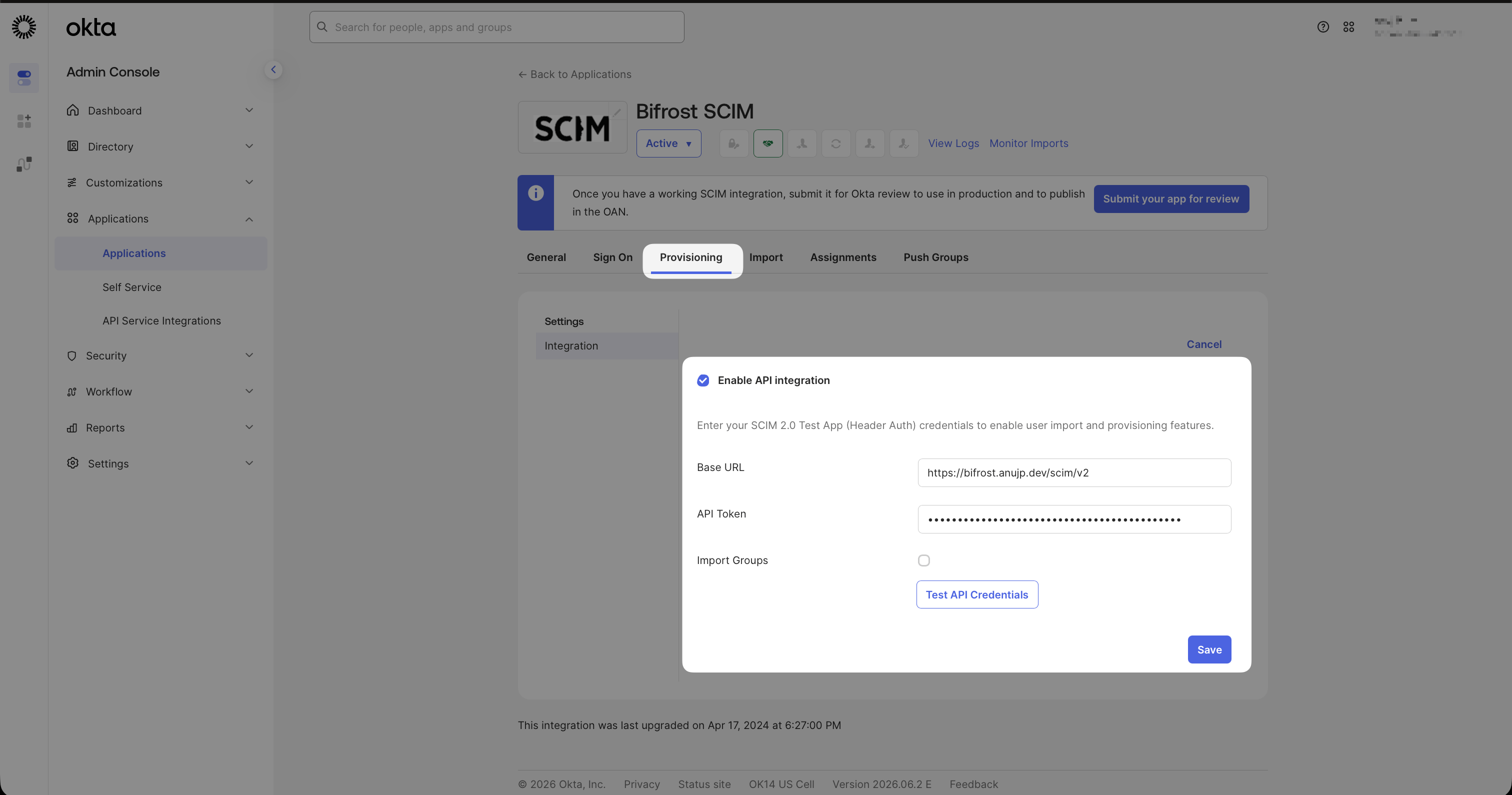 Okta SCIM app Configure API Integration dialog with Base URL and API Token fields filled in