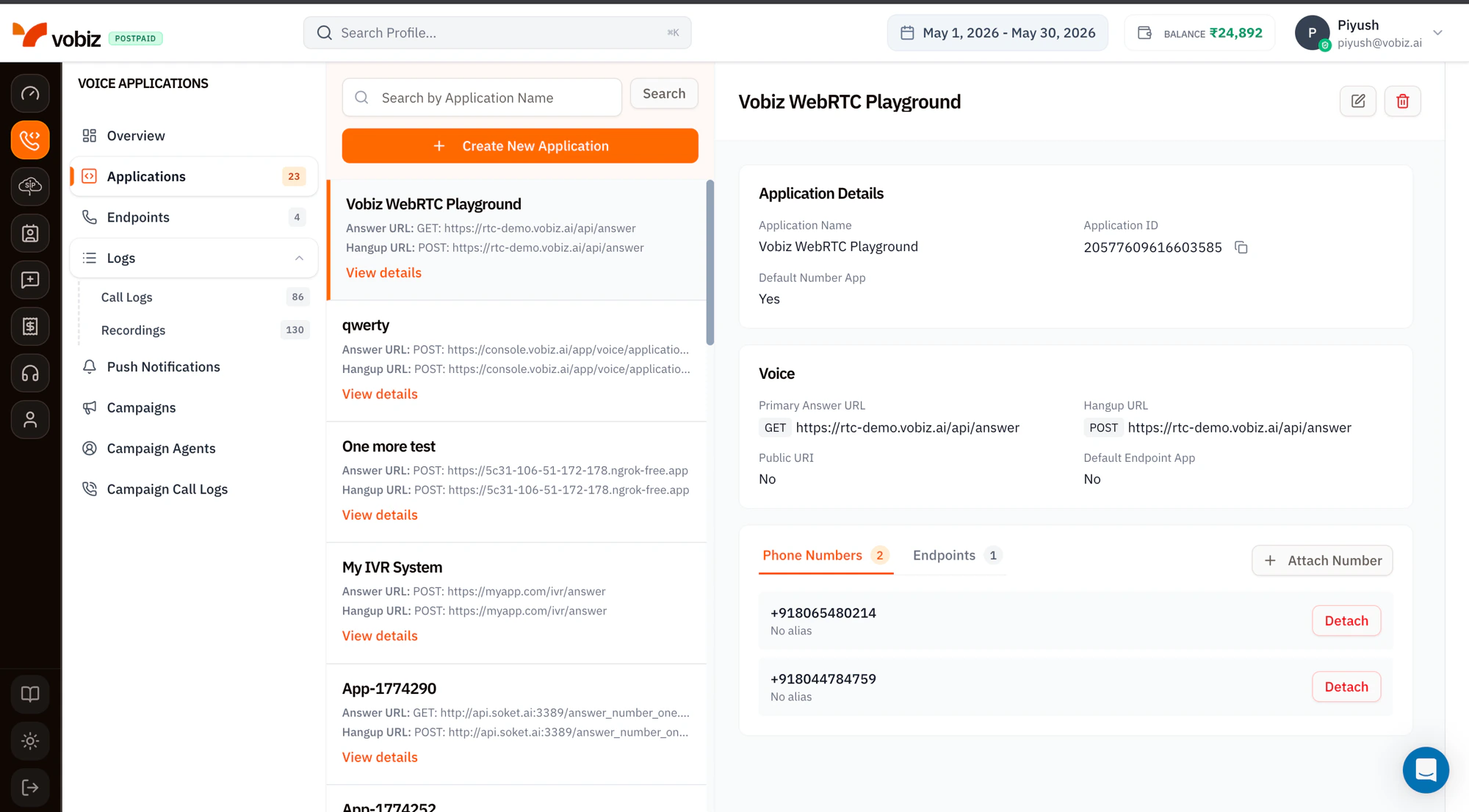 Voice Applications page split into three columns — the navigation sidebar on the left, a searchable list of XML applications in the middle showing apps like Vobiz WebRTC Playground and qwerty, and an Application Details panel on the right showing Application ID, Answer URL, Hangup URL, attached phone numbers, and endpoints
