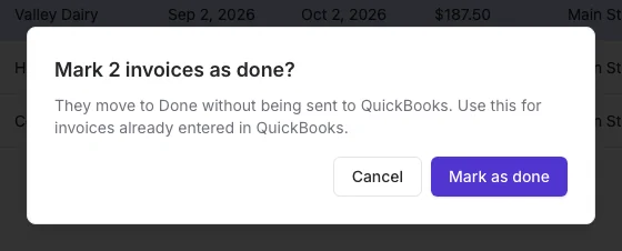 Confirmation dialog asking to mark 2 invoices as done without sending them to QuickBooks