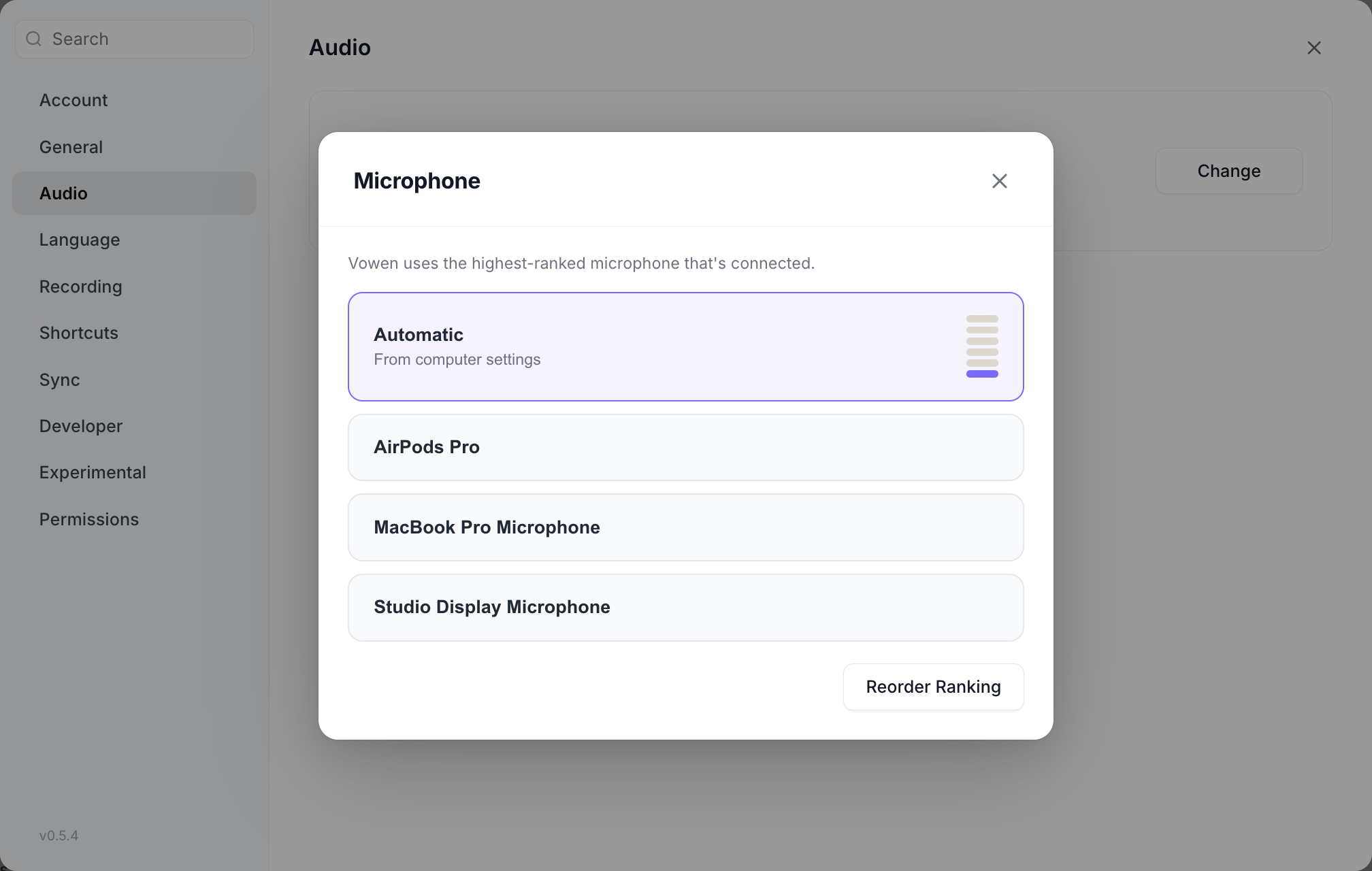 The microphone picker listing Automatic, AirPods Pro, MacBook Pro Microphone and Studio Display Microphone, with a level meter beside the selected row