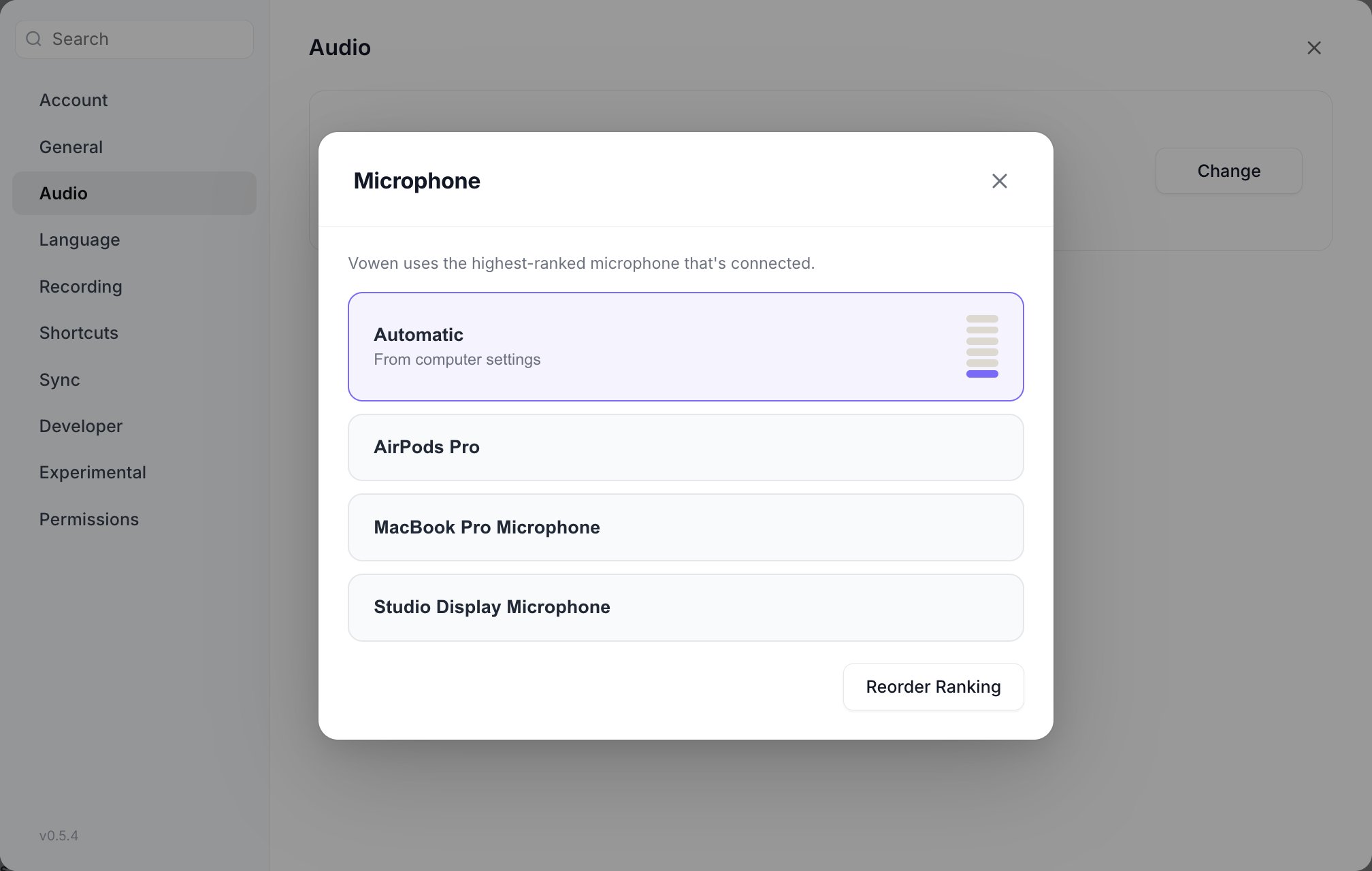 The microphone picker listing Automatic, AirPods Pro, MacBook Pro Microphone and Studio Display Microphone, with a level meter beside the selected row