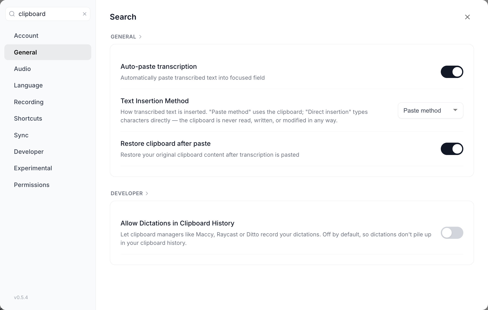 The Settings modal with clipboard typed into the search field, showing a General group containing Auto-paste transcription, Text Insertion Method and Restore clipboard after paste, and a Developer group containing Allow Dictations in Clipboard History, each with its working toggle