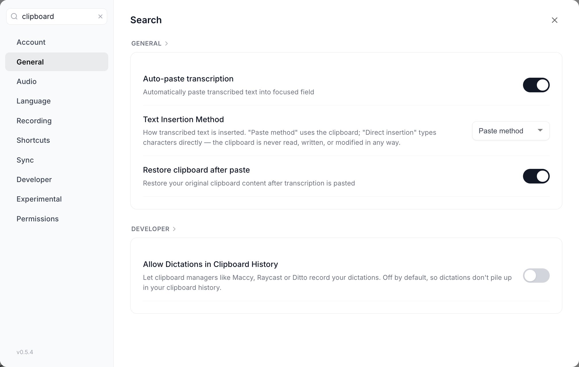The Settings modal with clipboard typed into the search field, showing a General group containing Auto-paste transcription, Text Insertion Method and Restore clipboard after paste, and a Developer group containing Allow Dictations in Clipboard History, each with its working toggle